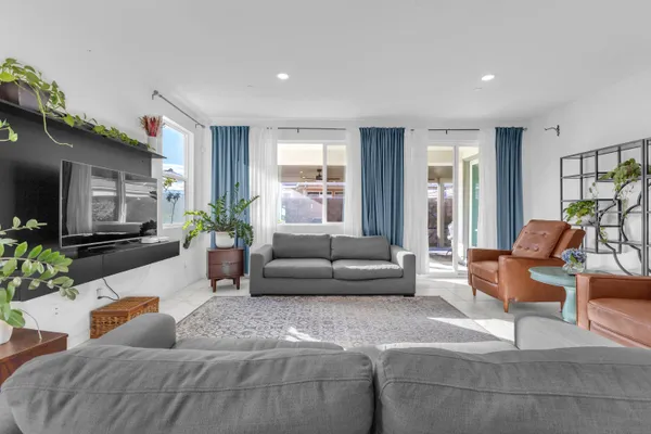 a living room with furniture and a large window