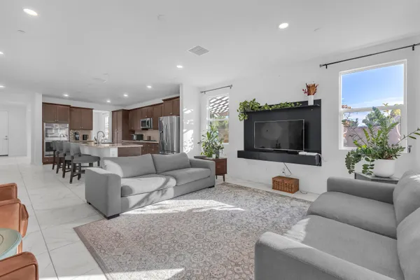 a room with a bed and a flat screen tv