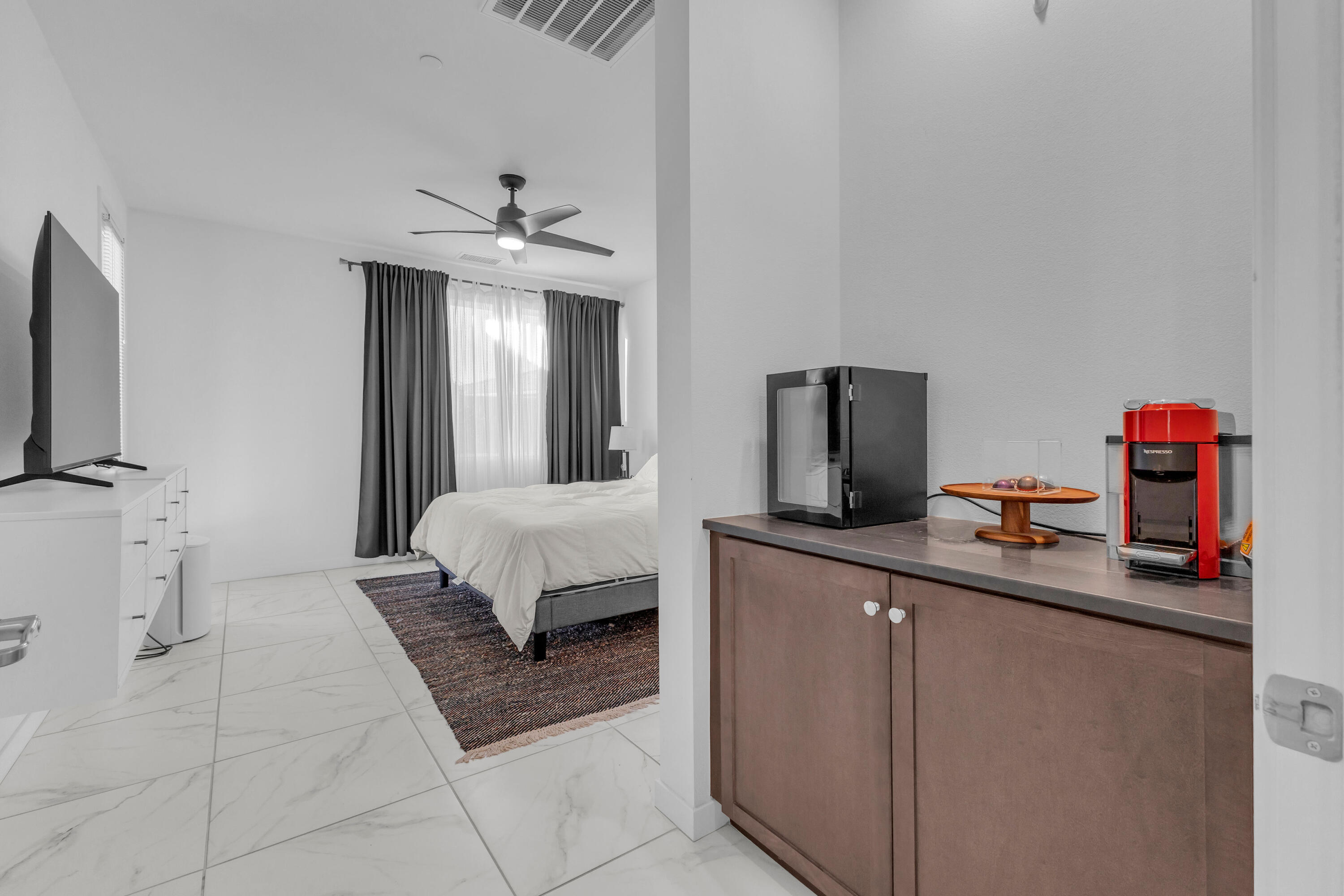 39763 Majorca Drive South Indio, CA 92203 - Photo 26 of 57 a bedroom with a bed and a flat screen tv