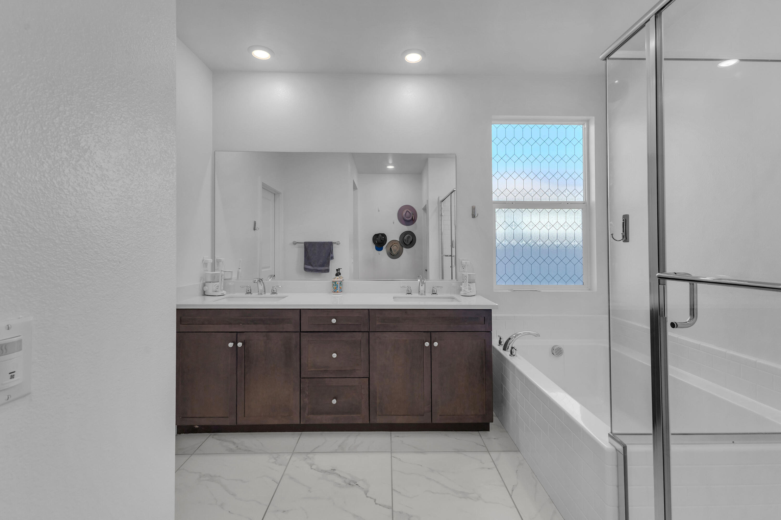 39763 Majorca Drive South Indio, CA 92203 - Photo 30 of 57 a spacious bathroom with a granite countertop sink a mirror and a bathtub