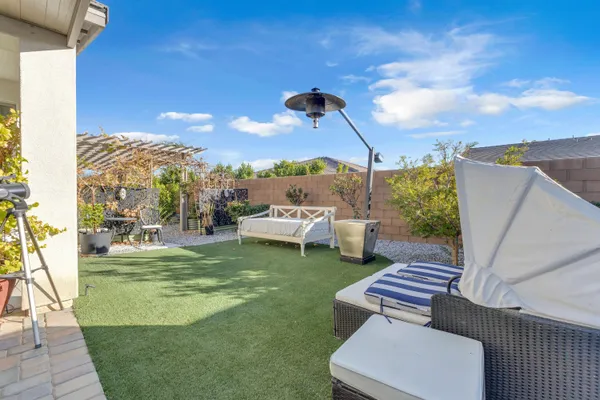a view of a patio with chair and tables