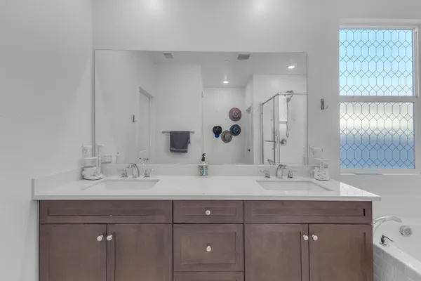 a view of an empty room with a ceiling fan and a window