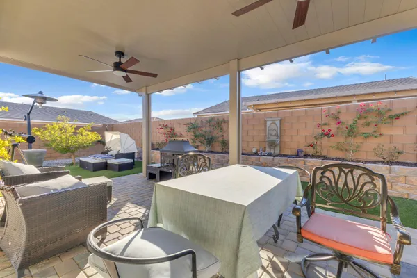 a backyard of a house with outdoor seating