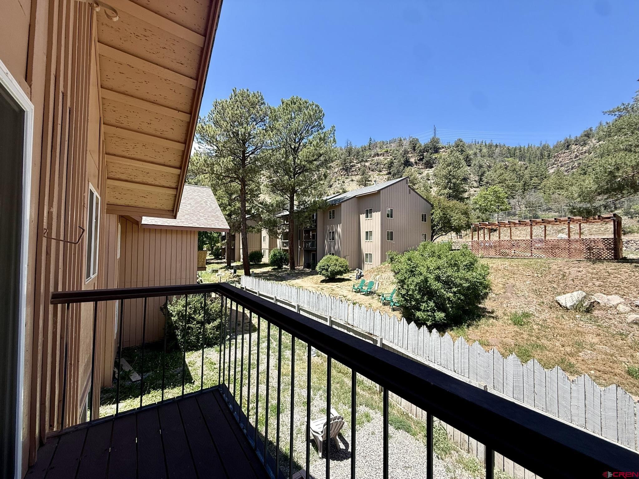 34237 Highway 550, Unit 27 Durango, CO 81301 - Photo 13 of 45 a view of a house with large windows and a table