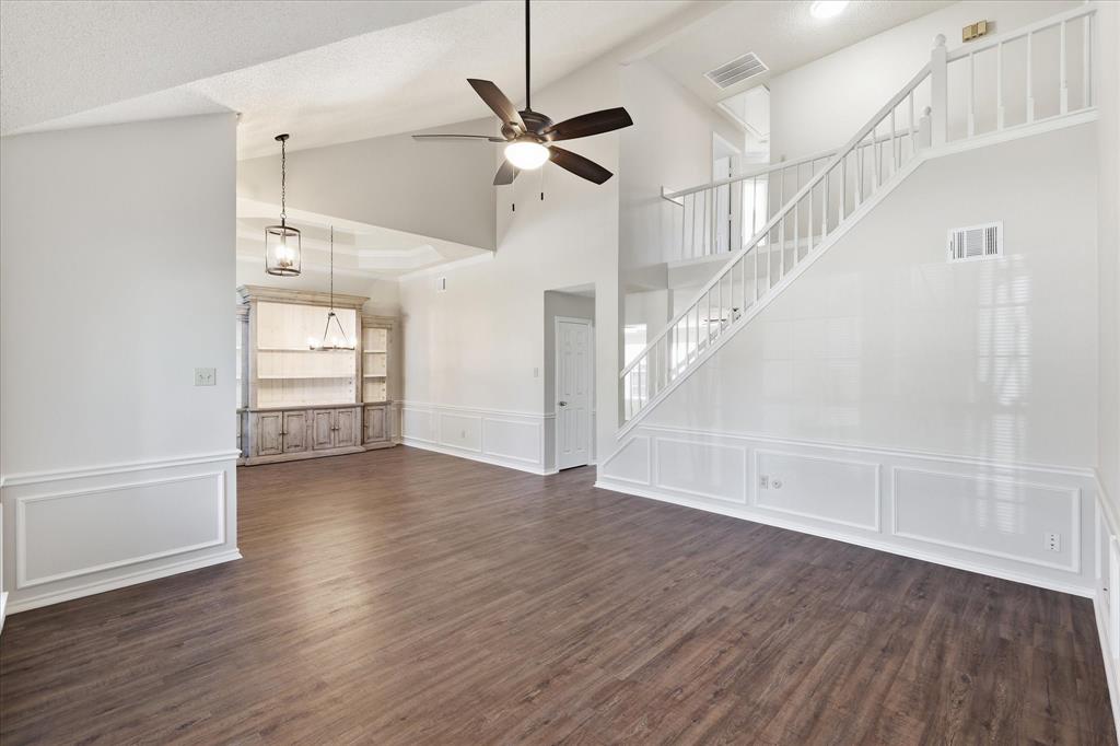 318 Lodge Road Coppell, TX 75019 - Photo 10 of 35 Enjoy an open-concept layout where the living and dining spaces connect seamlessly, making entertaining feel effortless.