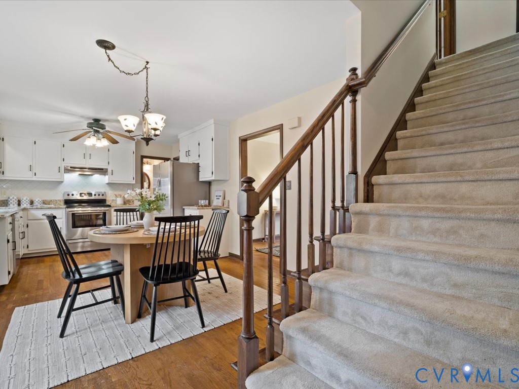 1145 Timber Trace Road Powhatan, VA 23139 - Photo 19 of 32 a view of a dining room with furniture and wooden floor