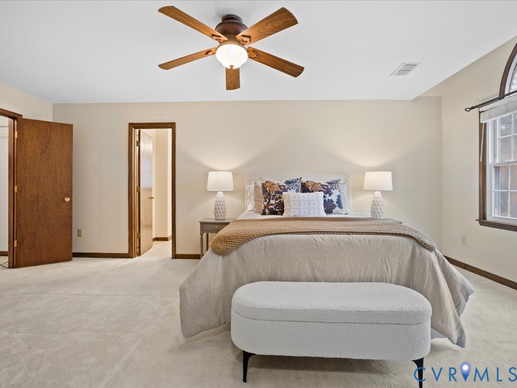 1145 Timber Trace Road Powhatan, VA 23139 - Photo 20 of 32 a bedroom with a bed and a ceiling fan