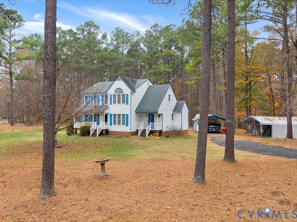 1145 Timber Trace Road Powhatan, VA 23139 - Photo 31 of 32 a front view of a house with a yard