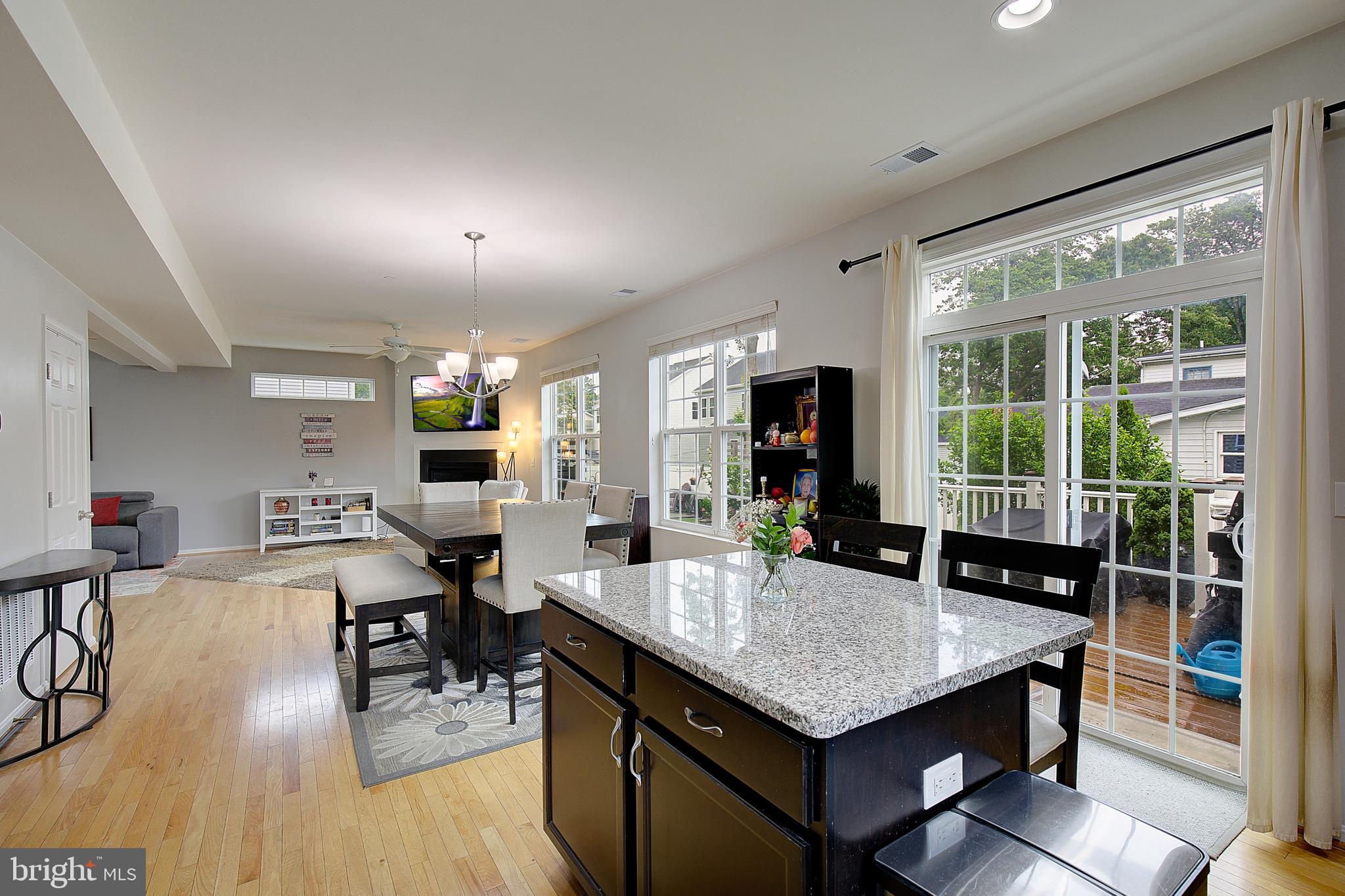 403 Venton Road Edgewater, MD 21037 - Photo 20 of 62 a kitchen with a table chairs and wooden floor