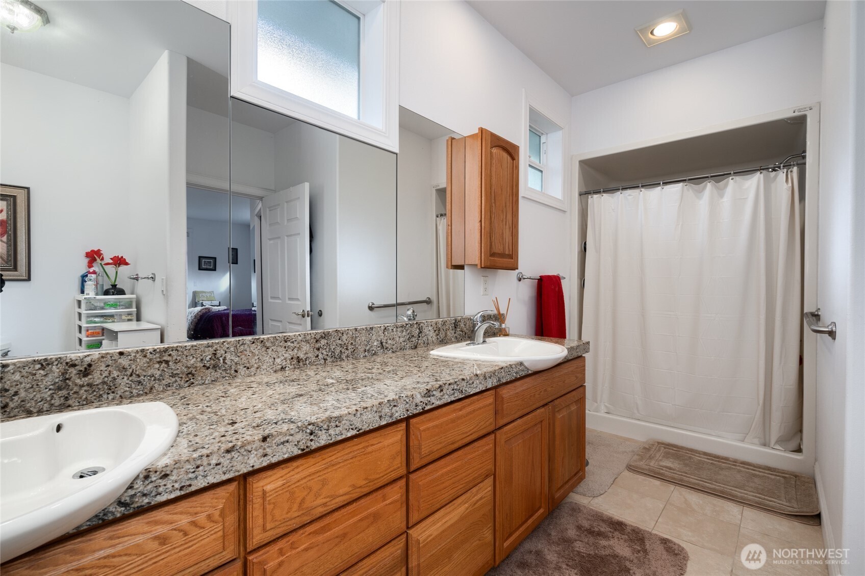 4111 R Avenue Anacortes, WA 98221 - Photo 22 of 37 a bathroom with a granite countertop sink and a mirror