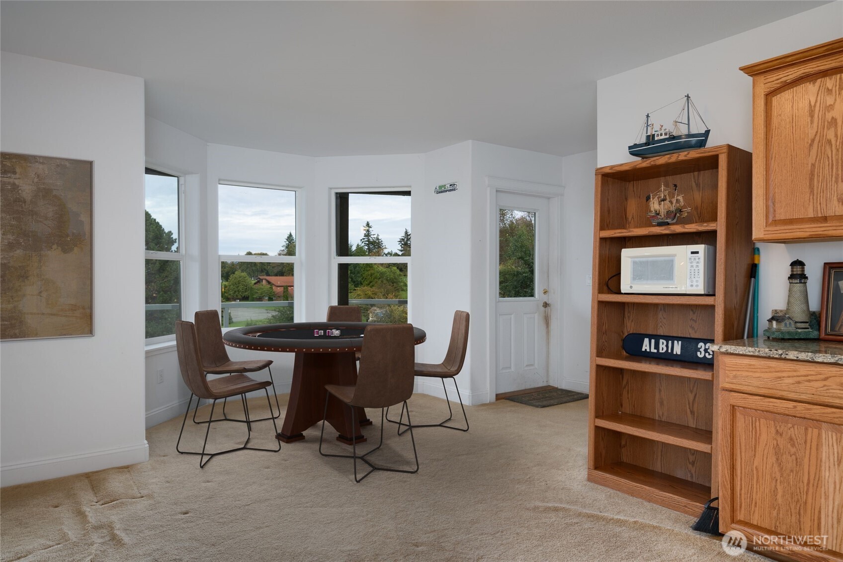 4111 R Avenue Anacortes, WA 98221 - Photo 28 of 37 a view of a workspace with furniture and windows