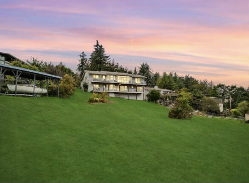 4111 R Avenue Anacortes, WA 98221 - Photo 4 of 37 a view of a garden with houses in the back
