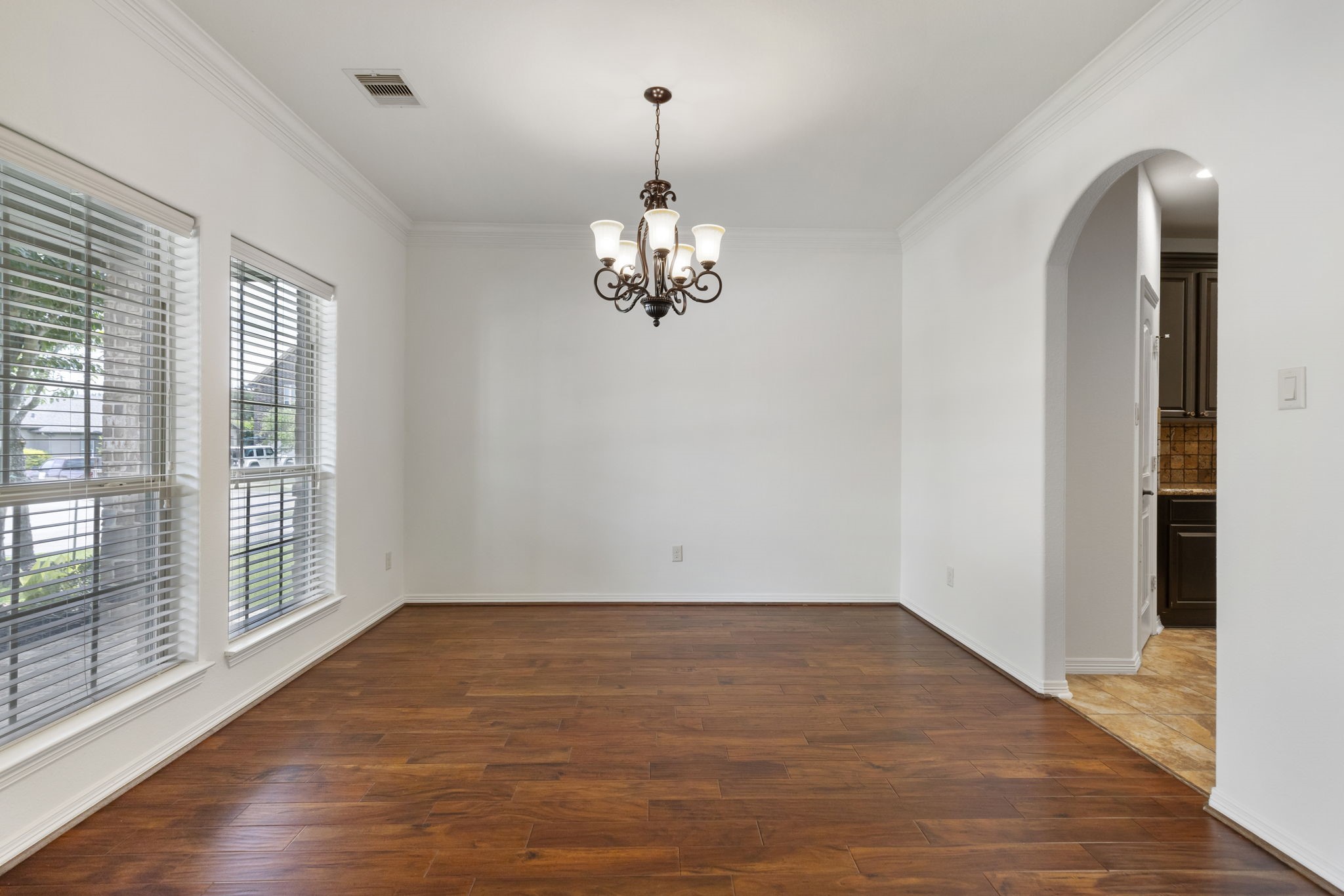 23911 Augusta Falls Lane Spring, TX 77389 - Photo 6 of 40 wooden floor in an empty room with a window