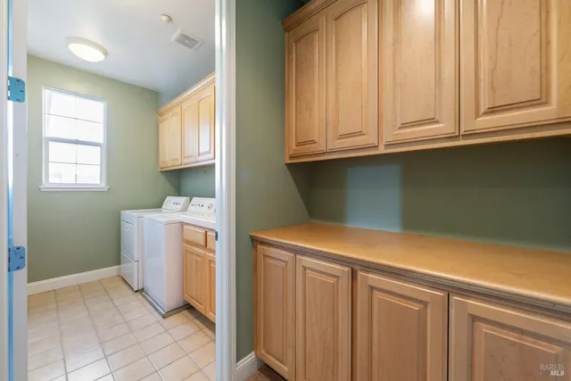 a utility room with a sink washer and dryer
