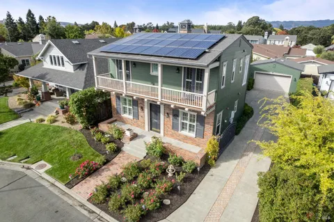 a view of multiple houses with a yard