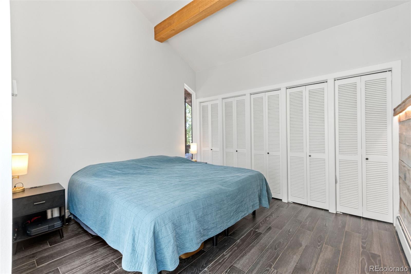 4316 Smith Hill Road Black Hawk, CO 80422 - Photo 11 of 48 a bedroom with a bed and wooden floor