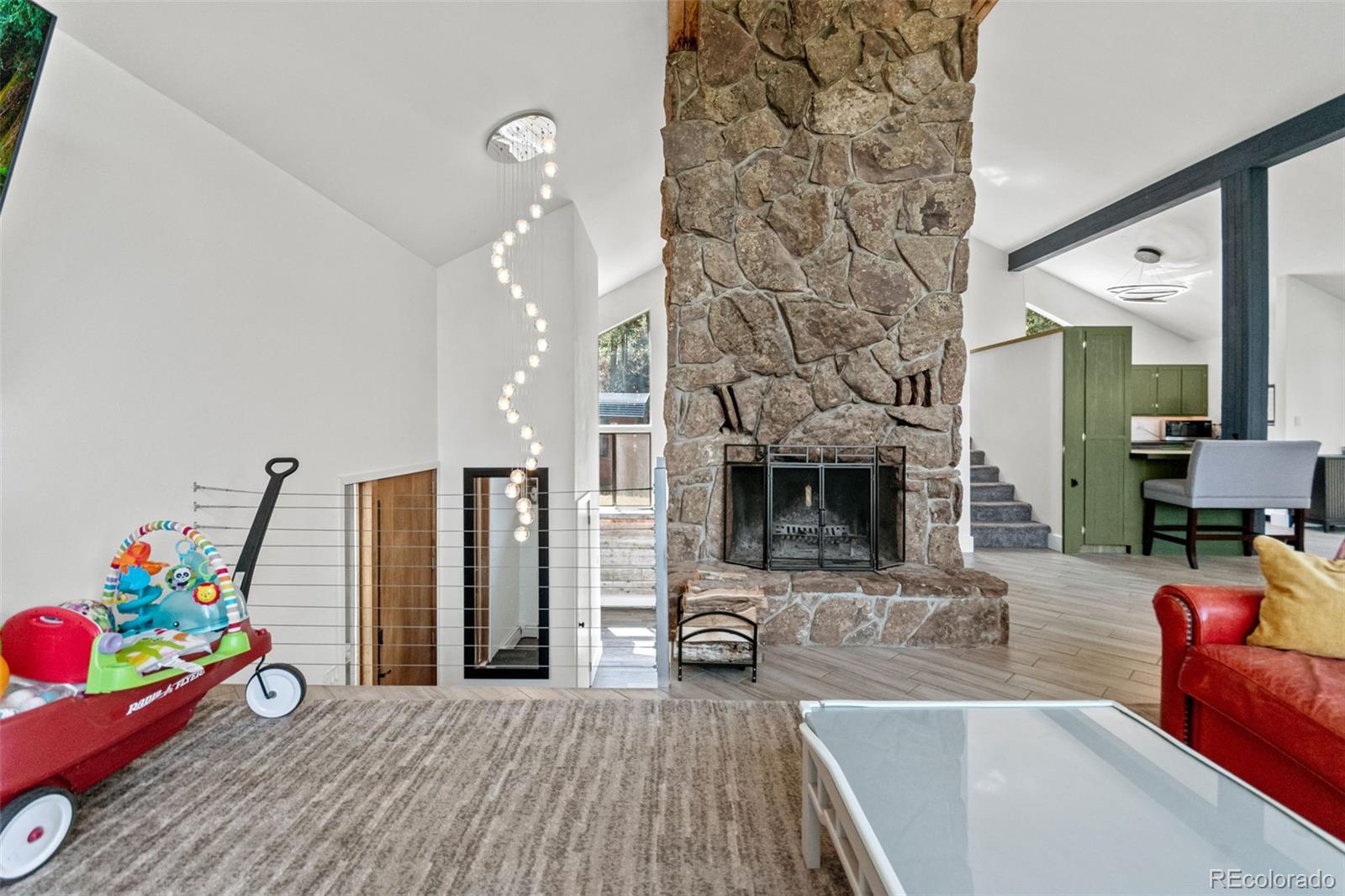 4316 Smith Hill Road Black Hawk, CO 80422 - Photo 18 of 48 a living room with furniture and a flat screen tv