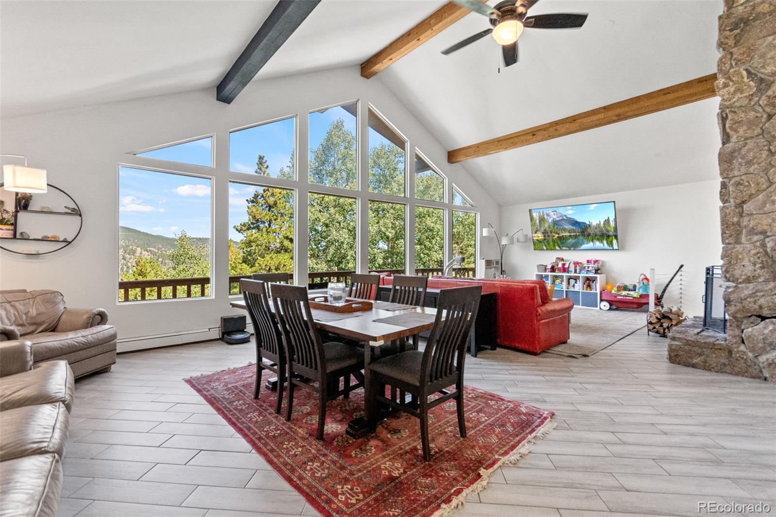 4316 Smith Hill Road Black Hawk, CO 80422 - Photo 20 of 48 a view of a dining room with furniture window and wooden floor