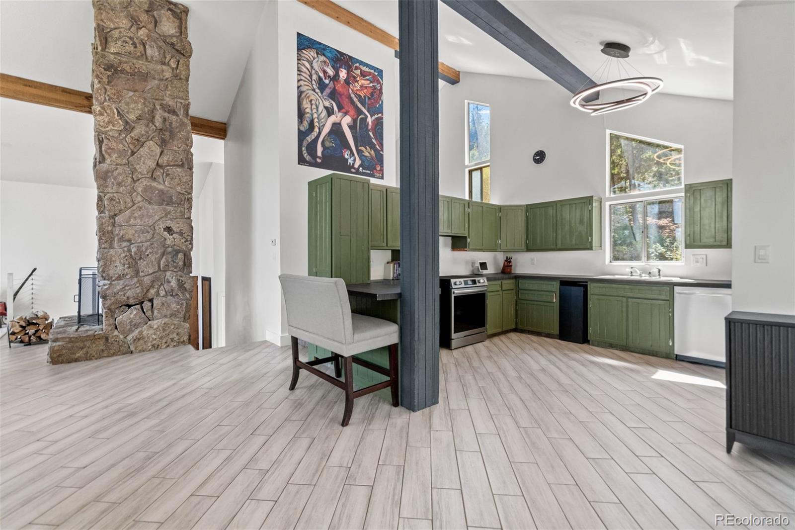 4316 Smith Hill Road Black Hawk, CO 80422 - Photo 23 of 48 a view of kitchen with furniture and wooden floor
