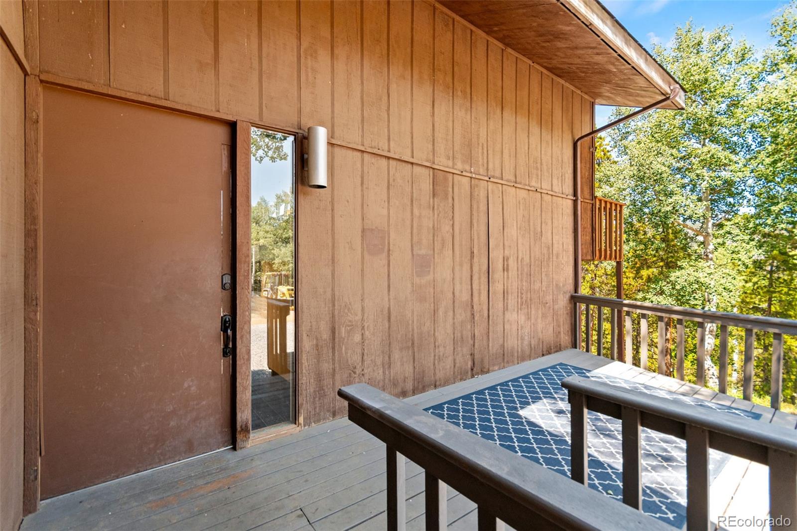 4316 Smith Hill Road Black Hawk, CO 80422 - Photo 3 of 48 a view of a balcony with furniture