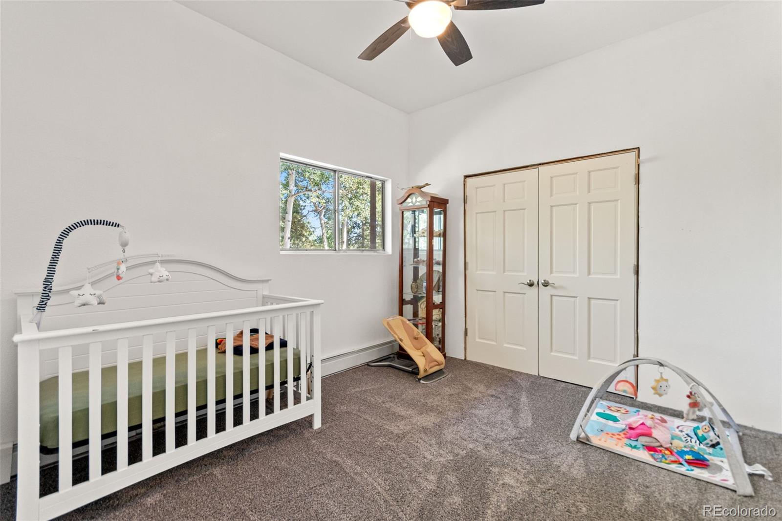4316 Smith Hill Road Black Hawk, CO 80422 - Photo 34 of 48 a bedroom with a bed and a window