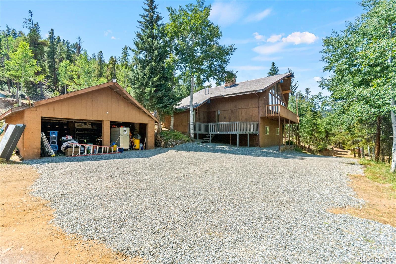 4316 Smith Hill Road Black Hawk, CO 80422 - Photo 41 of 48 front view of a house with a street