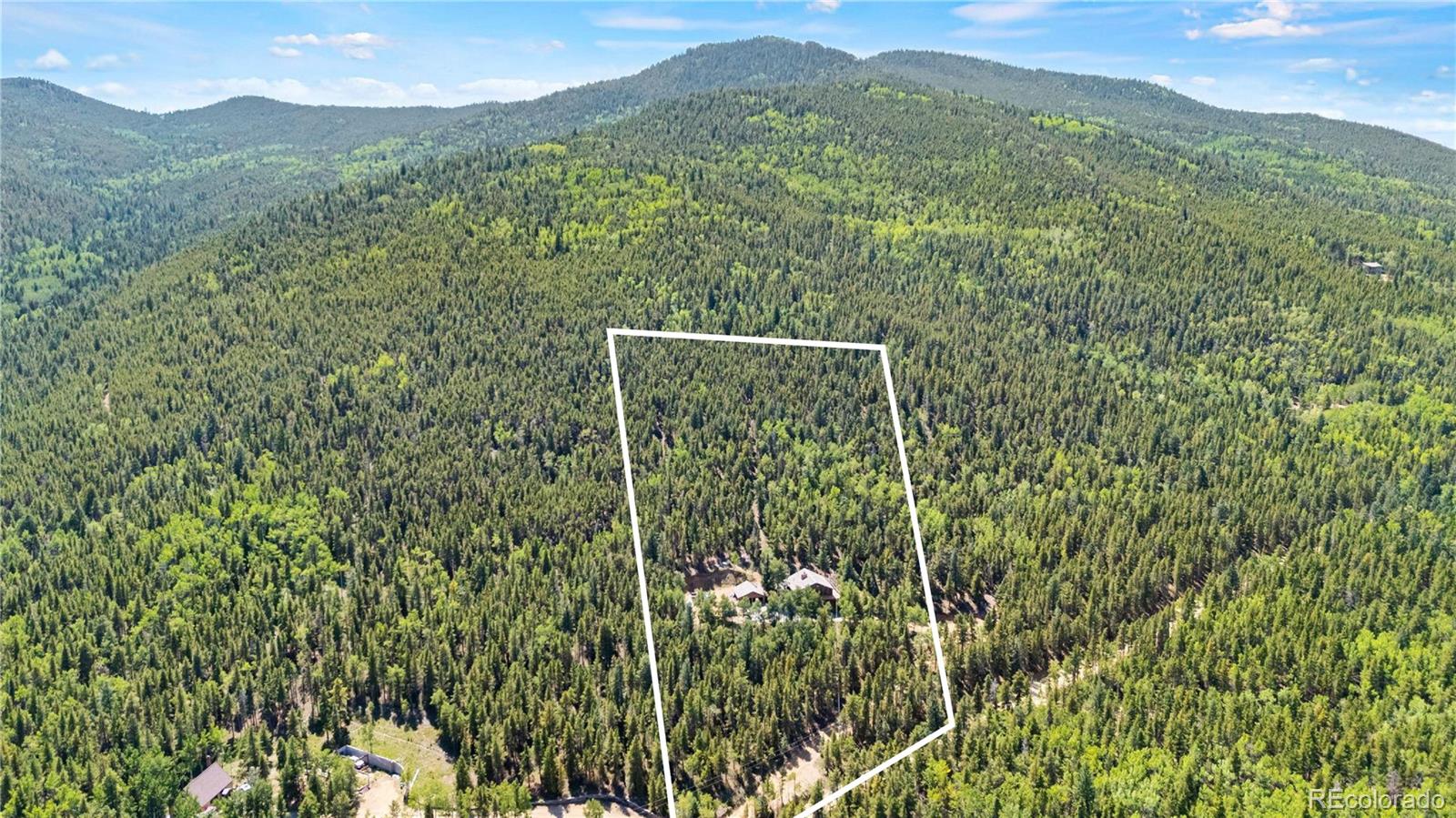 4316 Smith Hill Road Black Hawk, CO 80422 - Photo 45 of 48 a view of a field with a tree in the background