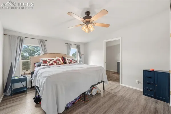 a bedroom with a bed and a dresser
