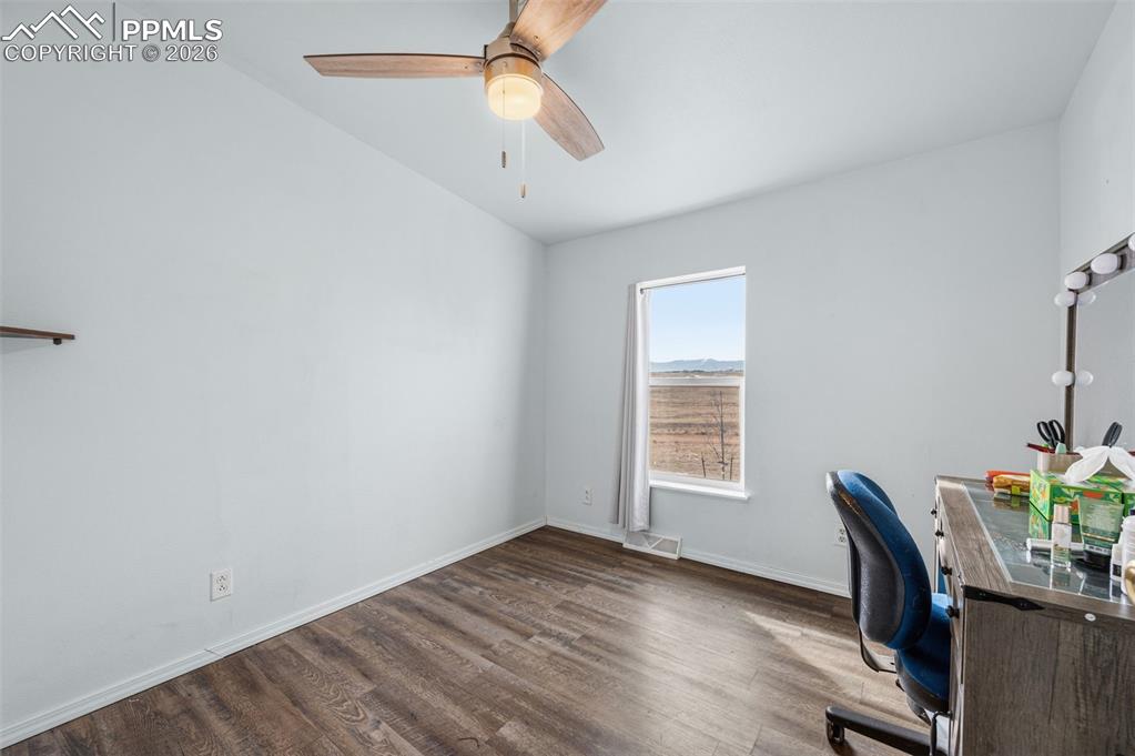 5535 Peerless Farms Road Peyton, CO 80831 - Photo 15 of 27 a view of a dining room with furniture and window