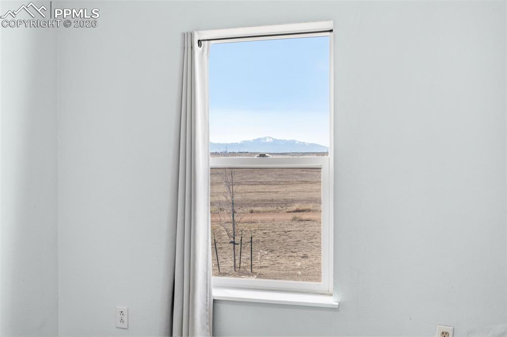 5535 Peerless Farms Road Peyton, CO 80831 - Photo 16 of 27 a view of a small space with a window