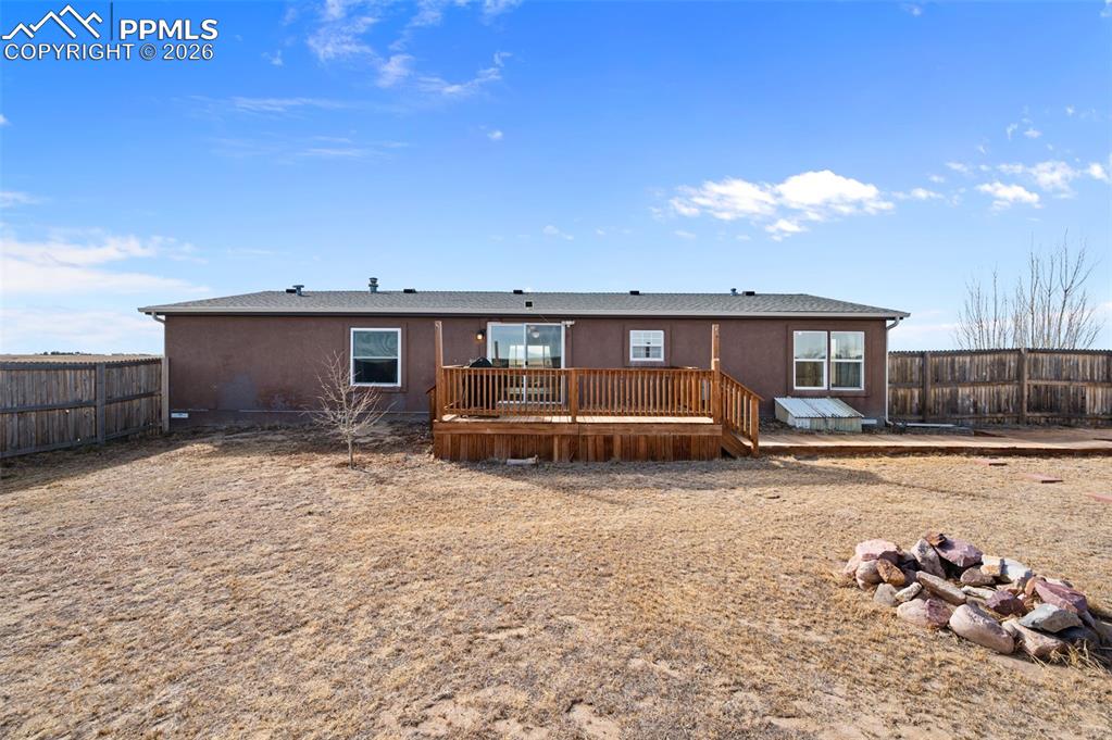 5535 Peerless Farms Road Peyton, CO 80831 - Photo 20 of 27 a view of a house with backyard and sitting area