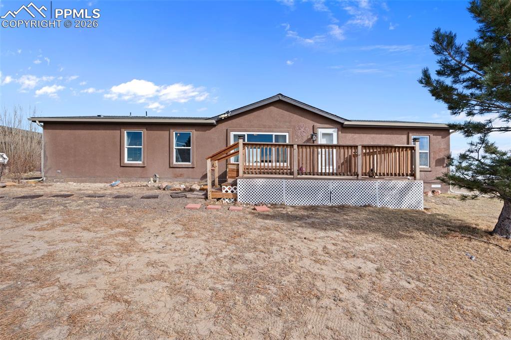 5535 Peerless Farms Road Peyton, CO 80831 - Photo 2 of 27 a view of a house with a yard