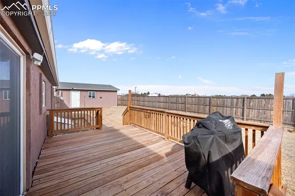 a view of a balcony with wooden floor