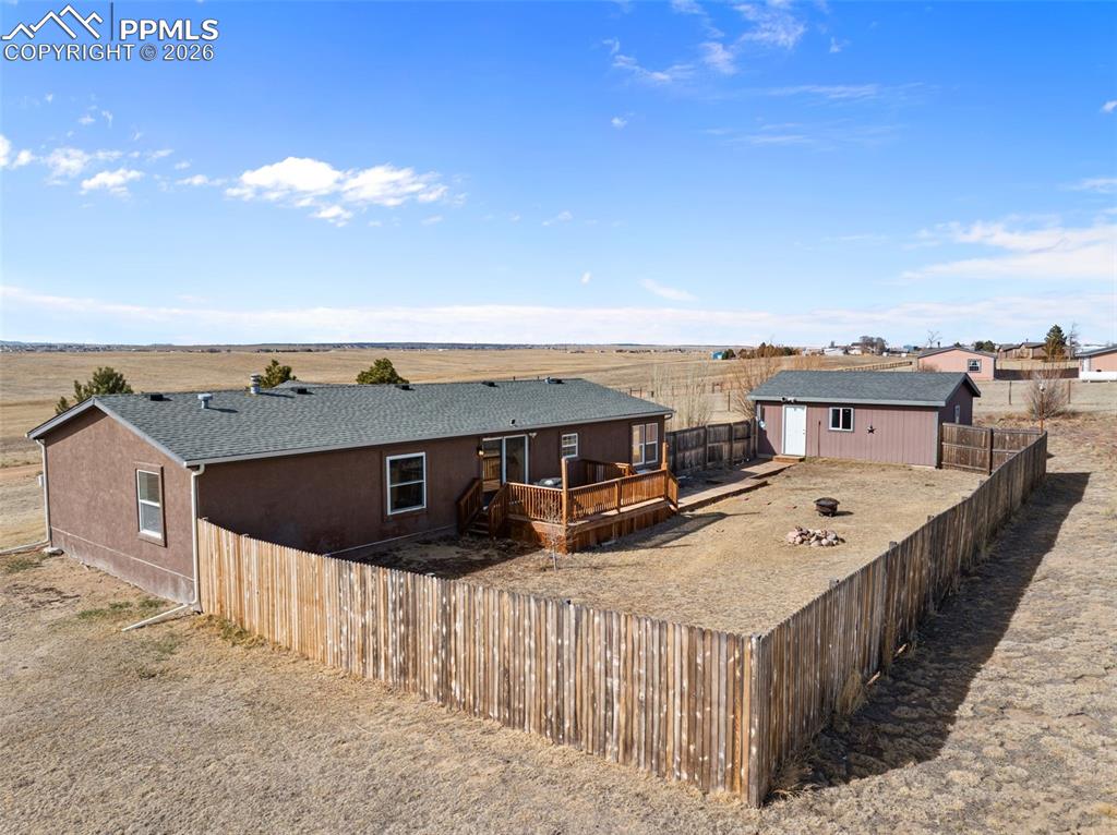 5535 Peerless Farms Road Peyton, CO 80831 - Photo 23 of 27 a view of a balcony with an outdoor space
