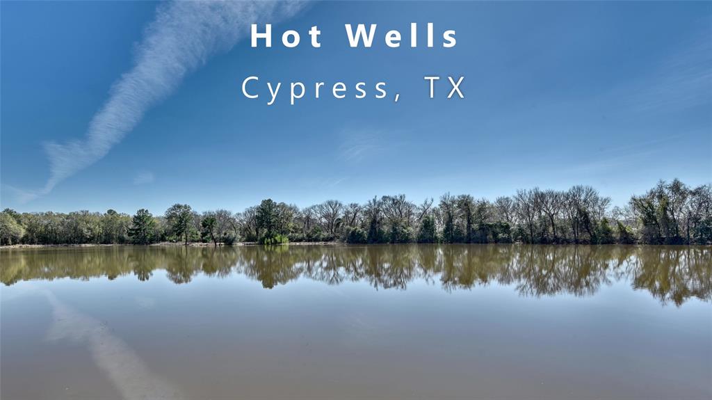 24815 West Northwest Freeway Street Northwest Cypress, TX 77429 - Photo 1 of 17 a view of a lake with houses in the background