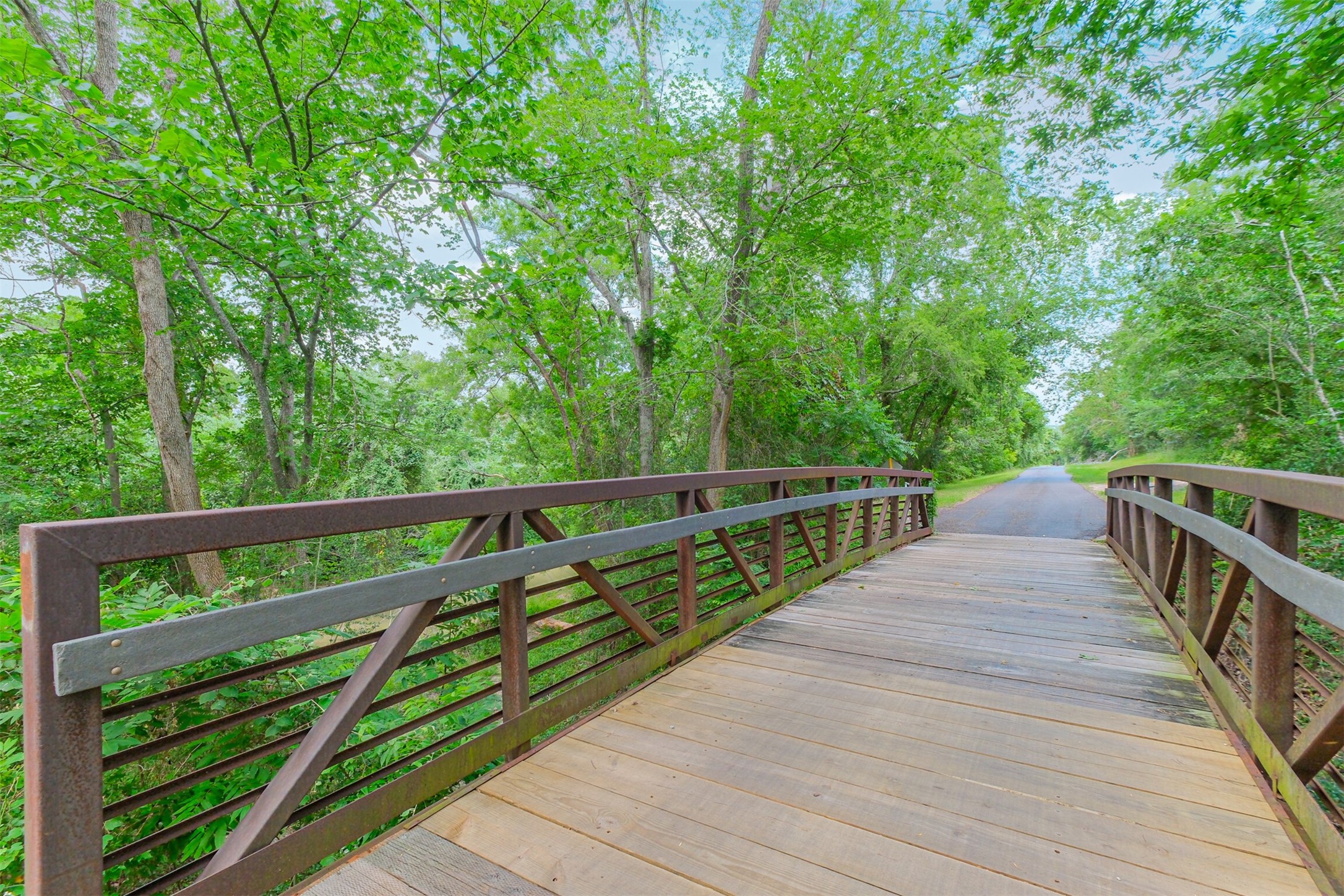 1007 Arrow Hill Road Houston, TX 77077 - Photo 49 of 50 a view of balcony with deck and trees