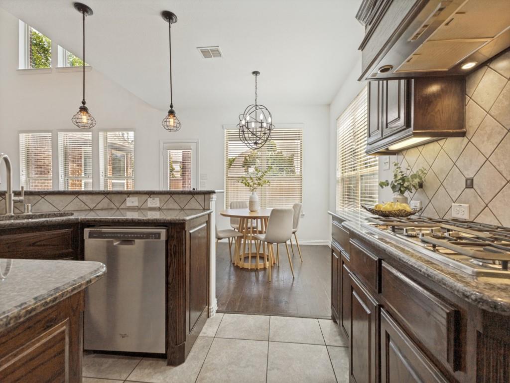 916 Redbird Lane Allen, TX 75013 - Photo 10 of 28 Gas burner cooktop with a built-in vent hood.
