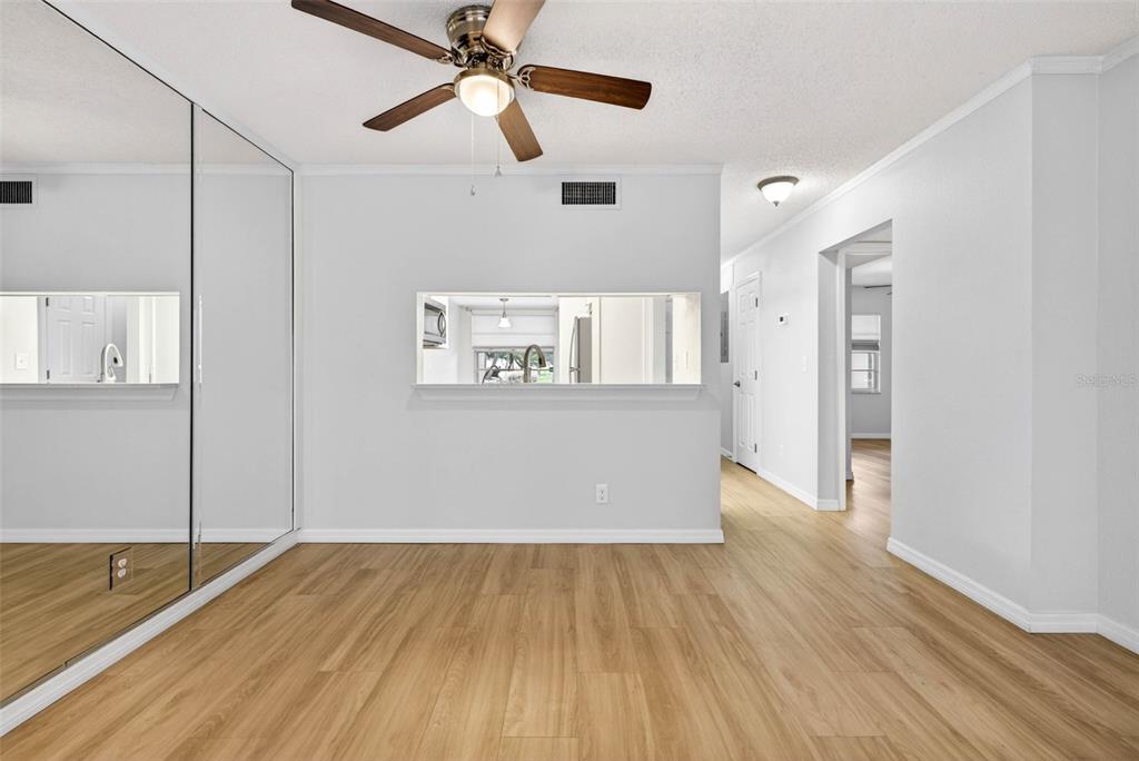 5197 Silent Loop, Unit 124 New Port Richey, FL 34652 - Photo 15 of 55 a view of a livingroom with wooden floor