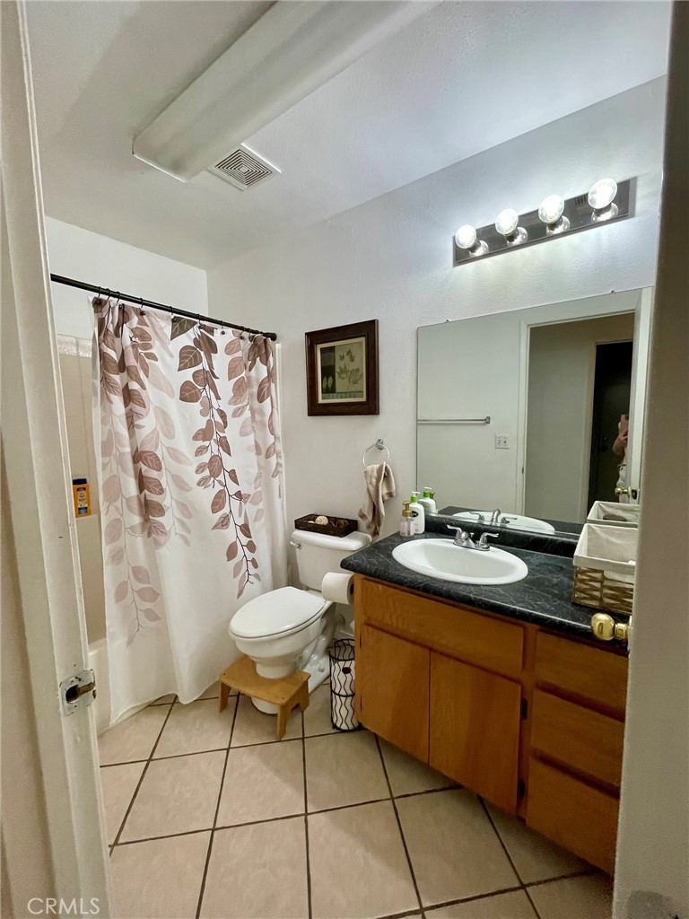 9654 Timothy Court Delhi, CA 95315 - Photo 6 of 18 a bathroom with a sink toilet and shower