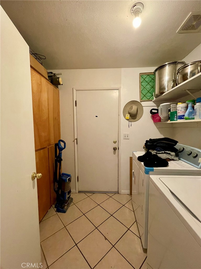 9654 Timothy Court Delhi, CA 95315 - Photo 7 of 18 a room with storage and utility