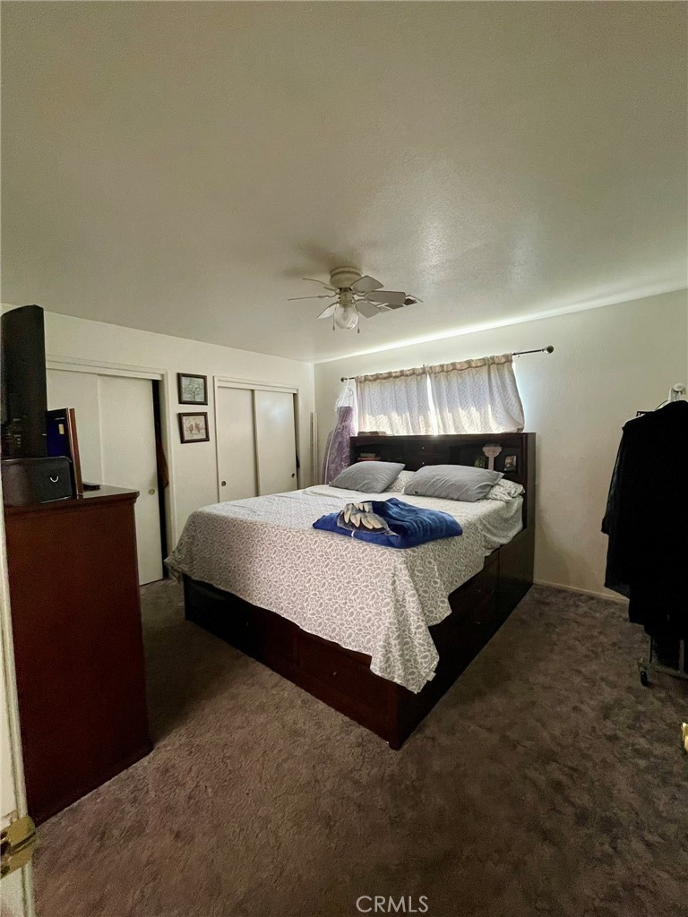 9654 Timothy Court Delhi, CA 95315 - Photo 10 of 18 a bedroom with a bed and mirror