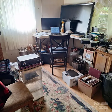 a room with furniture and wooden floor