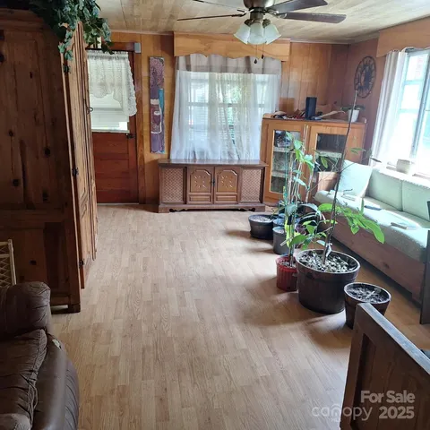 a room with lots of potted plants
