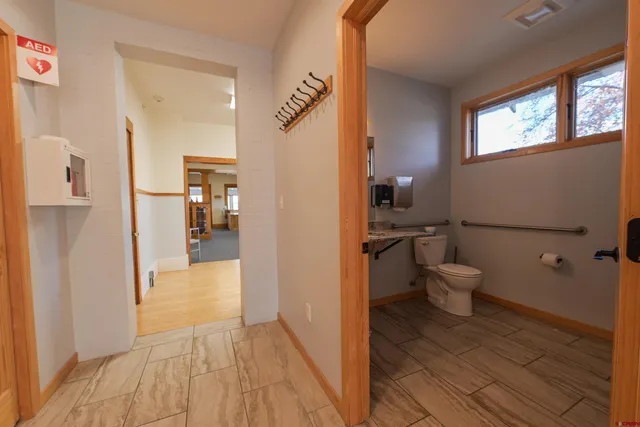 a bathroom with a toilet and a shower