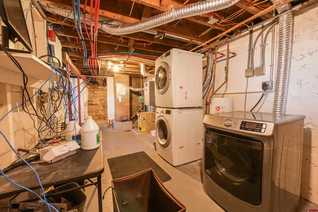 a view of a storage & utility room with racks on the wall