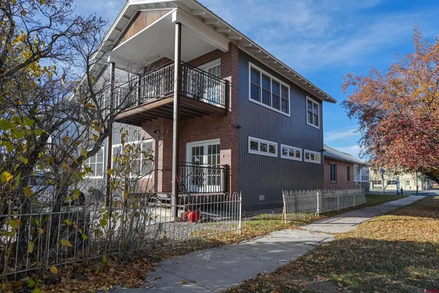 a front view of a house with parking