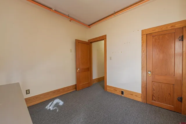 an empty room with closet area
