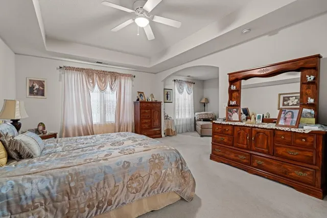 a bedroom with a bed and a dresser