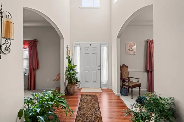 a hallway with with flower pot and a potted plant