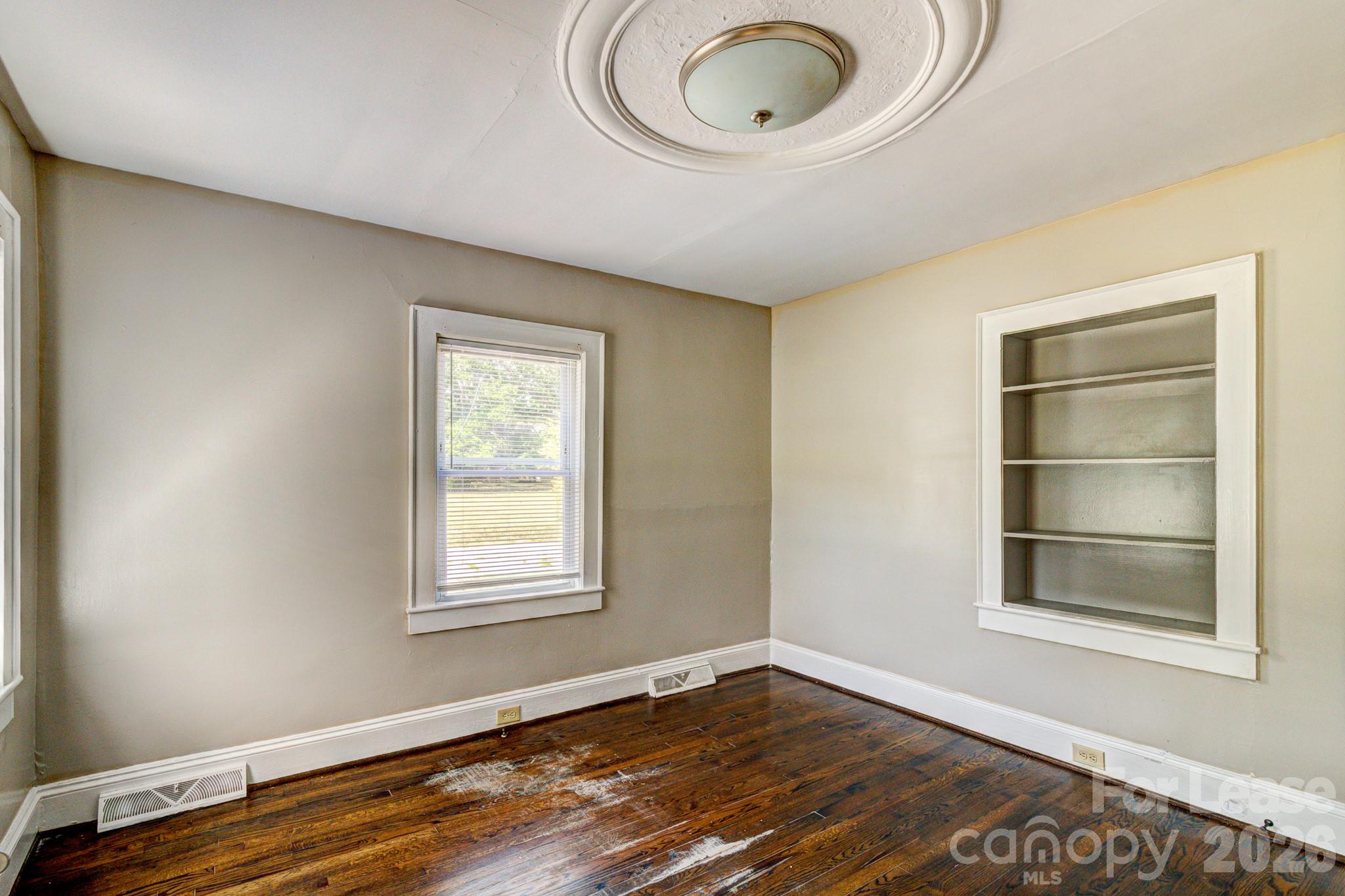 1006 Delview Road Cherryville, NC 28021 - Photo 5 of 10 a view of empty room with wooden floor and fan